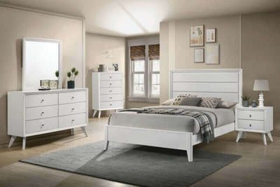Modern Dortmund white panel bed with textured headboard in a stylish bedroom setting featuring matching furniture.