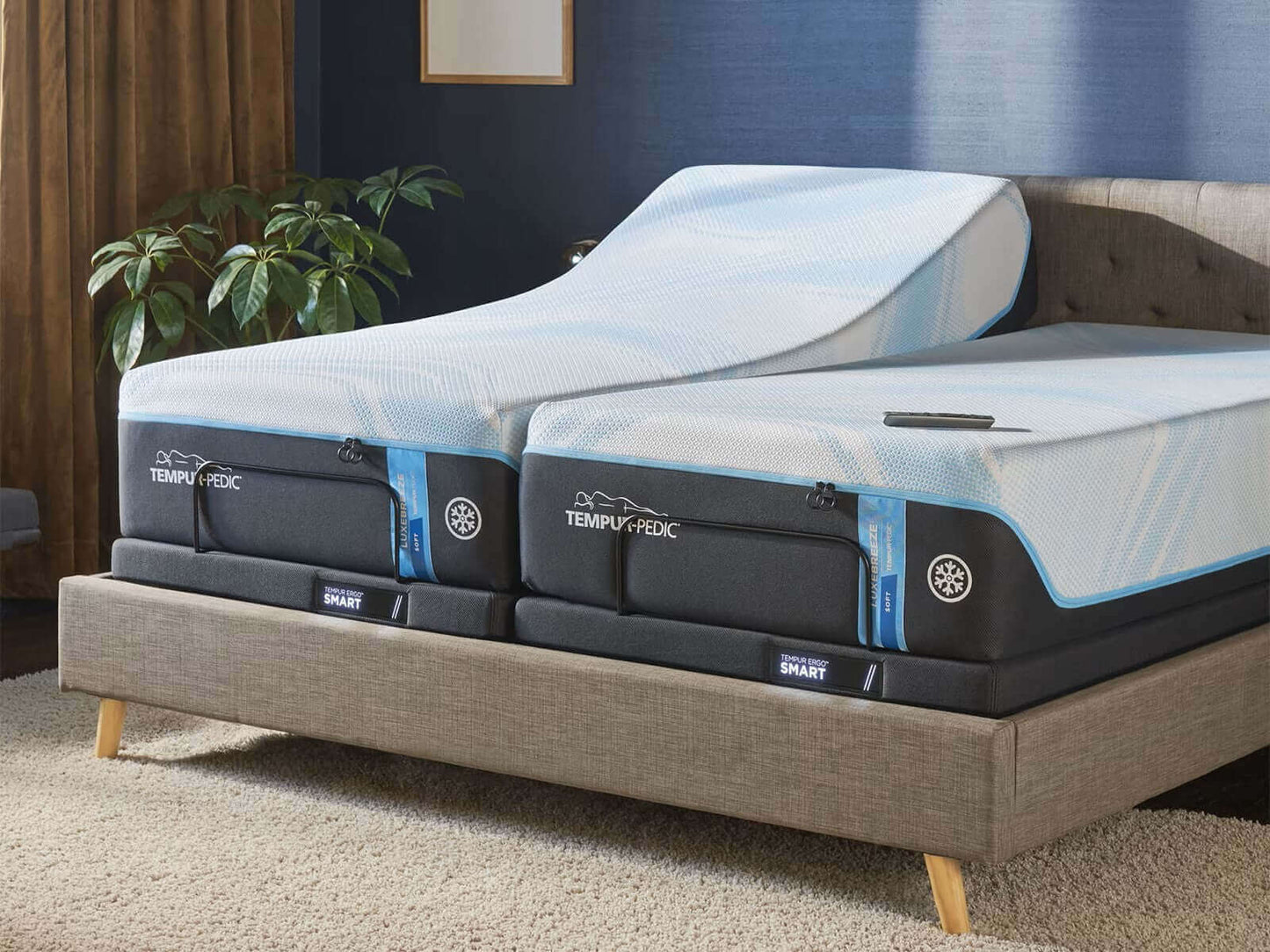 Tempur-Pedic TEMPUR-Ergo® Smart Adjustable Base with two adjustable mattresses in a modern bedroom setting.