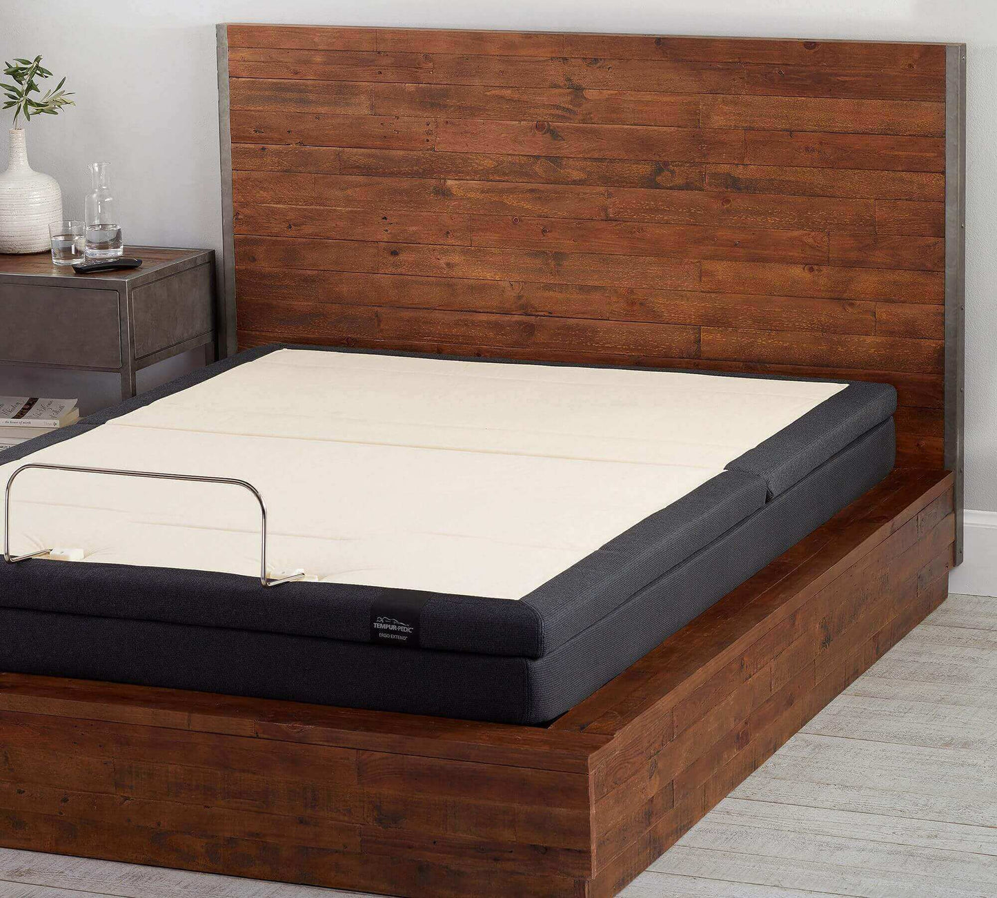 Tempur-Pedic TEMPUR-Extend Power Base on a stylish wooden bed frame with natural decor and neutral colors.