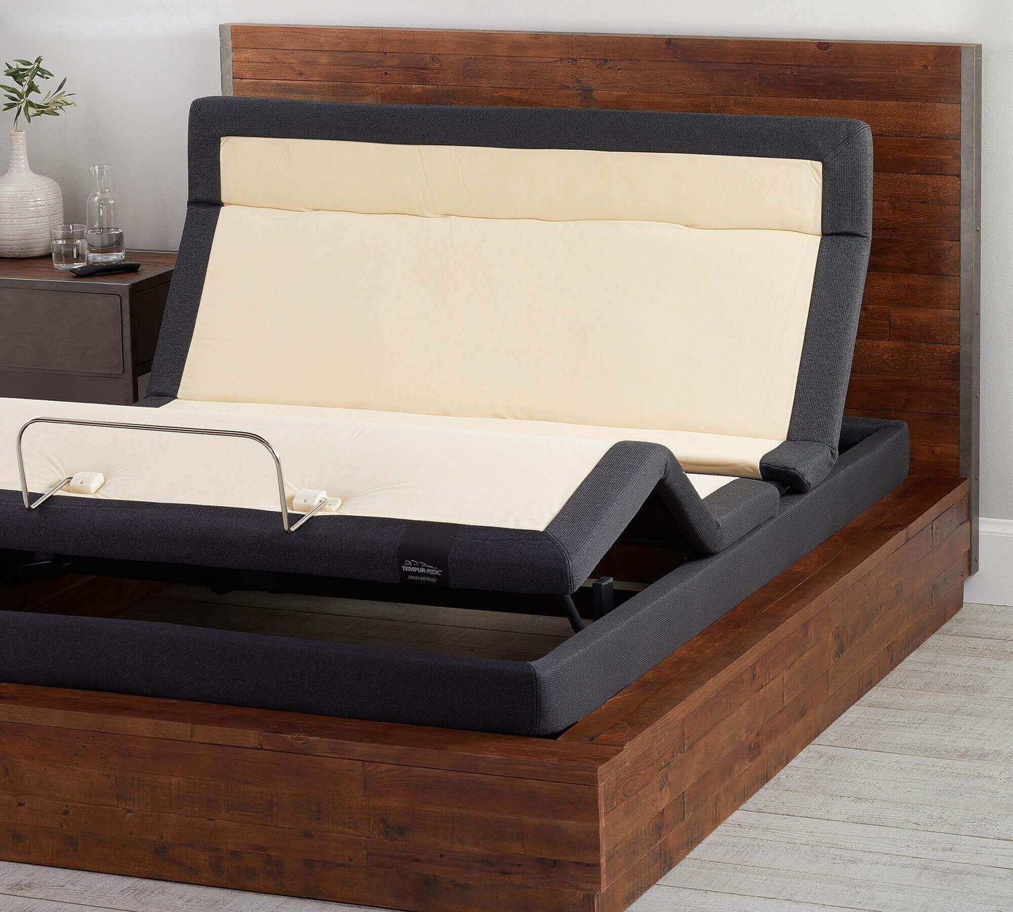 TEMPUR-Extend Power Base in adjustable position with modern wooden bed frame and plush mattress for personalized comfort.