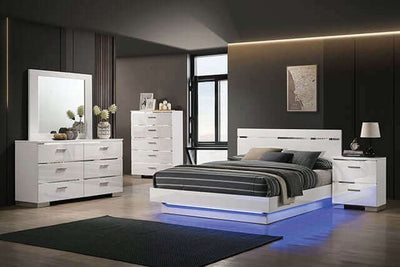 Modern white gloss bedroom set featuring LED platform bed, sleek headboard, and matching furniture in a stylish interior.