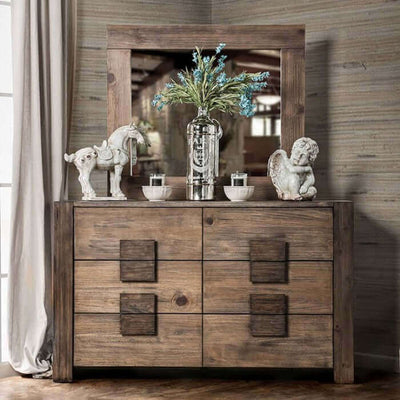 Rustic Janeiro dresser with wooden block pulls, mirror, and decorative accessories in a stylish interior setting.