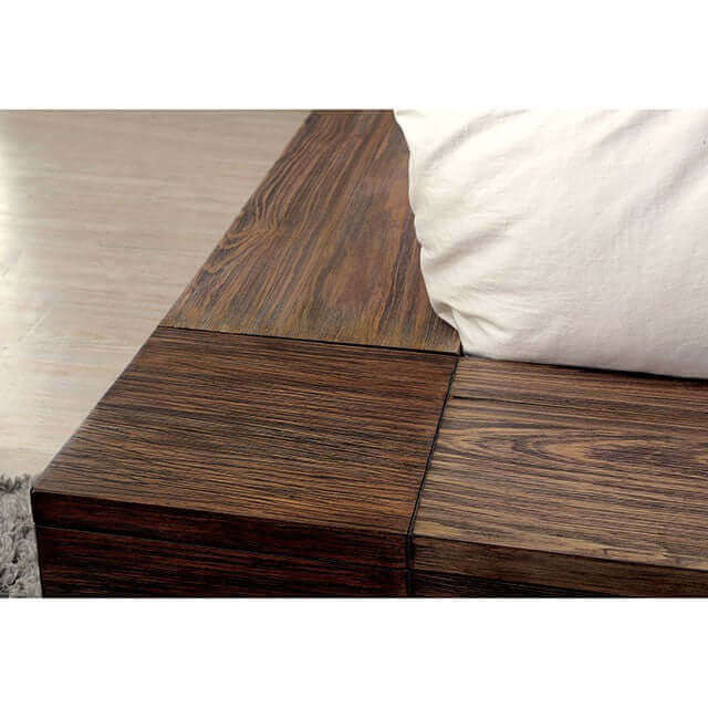 Close-up of the Janeiro Platform Storage Bed showcasing natural wood grain and low-profile design with a white pillow.
