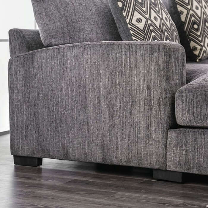Kaylee Gray sectional sofa side view featuring plush upholstery and stylish accent pillows on a wood base.