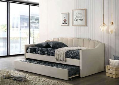 Kosmo Beige Daybed with staircase headboard, channel tufting, and pull-out trundle in a modern living space.