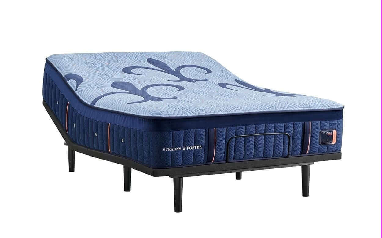 Stearns & Foster Lux Hybrid Medium 14" mattress showcasing a stylish blue design on a sturdy foundation.