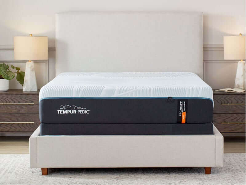 Tempur-Pedic TEMPUR-ProAdapt Firm 12" Mattress on bed frame in a stylish bedroom setting.