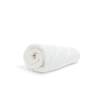 Rolled white cooling mattress pad made from rayon bamboo, offering plush comfort and breathability for enhanced sleep quality.