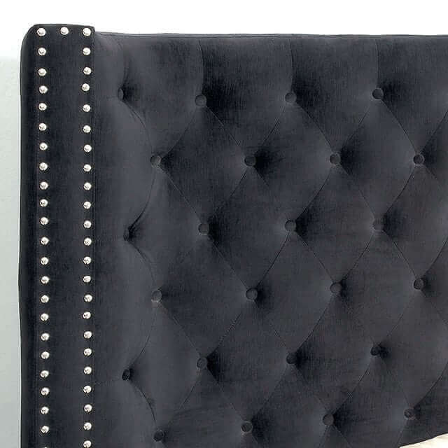 Close-up of the Rosabelle tufted wingback bed's black headboard with diamond button tufting and nailhead trim details.