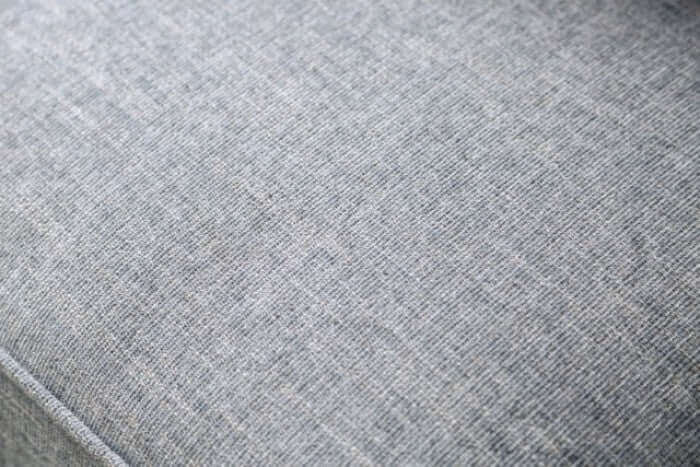 Close-up of Skyline Gray sofa fabric, showcasing its soft texture and neutral tone perfect for any living room decor.