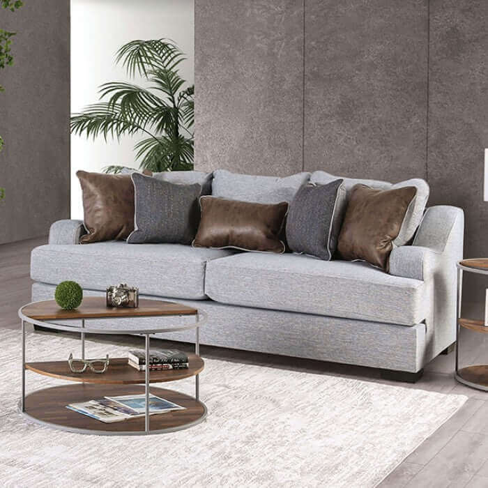 Skyline Gray Transitional Sofa with decorative throw pillows and modern side table in a stylish living room setting.