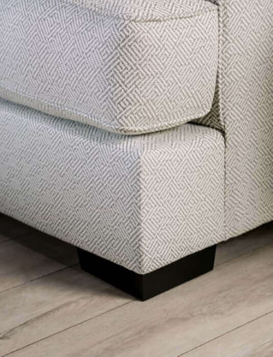 Corner view of Skyline Pewter Gray Transitional Sofa showcasing textured upholstery and sleek black legs.