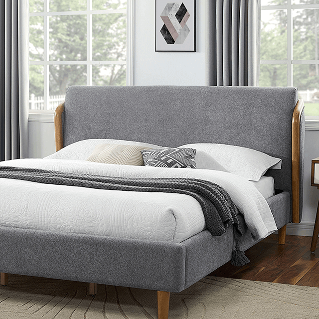 Ulstein Mid Century Platform Bed featuring gray upholstery and wooden wingback frame in a stylish bedroom setting.