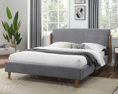Ulstein mid-century platform bed with gray upholstered headboard and tapered wooden legs in a modern bedroom setting.
