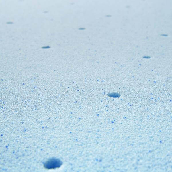 Close-up of Malouf Gel Memory Foam mattress topper's breathable surface with cooling gel dots for enhanced comfort.