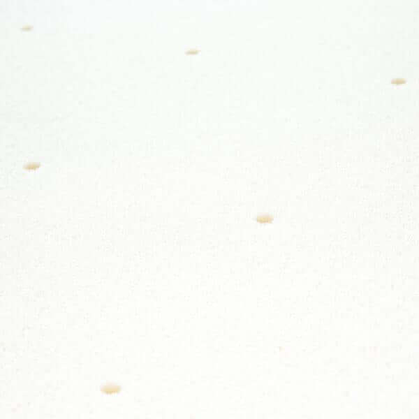 Close-up of Malouf Memory Foam Mattress topper surface showing breathable design with small holes for enhanced comfort.