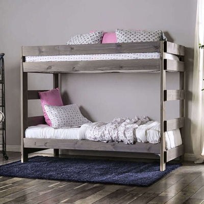 Rustic gray Arlette pine wood bunk bed with stylish bedding in a cottage-inspired bedroom setting.