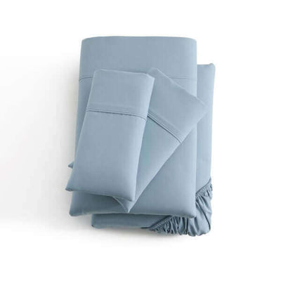 Malouf Pacific Soft Knit Microfiber Sheet Set in soft blue color, featuring pillowcases and fitted sheets with a smooth finish.