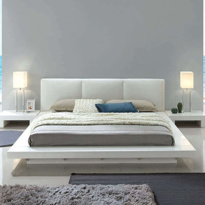 Christie White modern platform bed featuring sleek minimalist design, low-profile headboard, and flush night stands in a stylish bedroom setting.