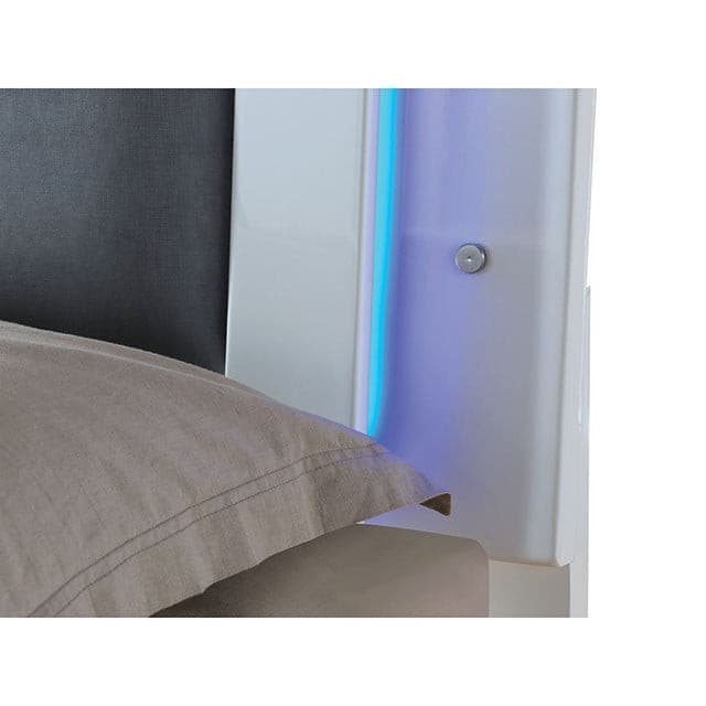 Close-up of the Clementine White 4pc Bedroom Set's LED light feature on the tufted leatherette headboard.
