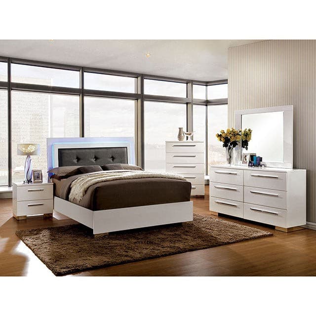 Contemporary bedroom featuring a white dresser, bed with gray headboard, and nightstands in a modern setting.