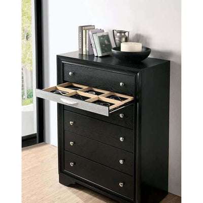 Contemporary black dresser with open jewelry drawer, showcasing silver pulls and a sleek, modern aesthetic.