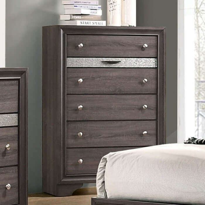 Glamorous gray chest of drawers with silver accents, enhancing bedroom aesthetics and storage.
