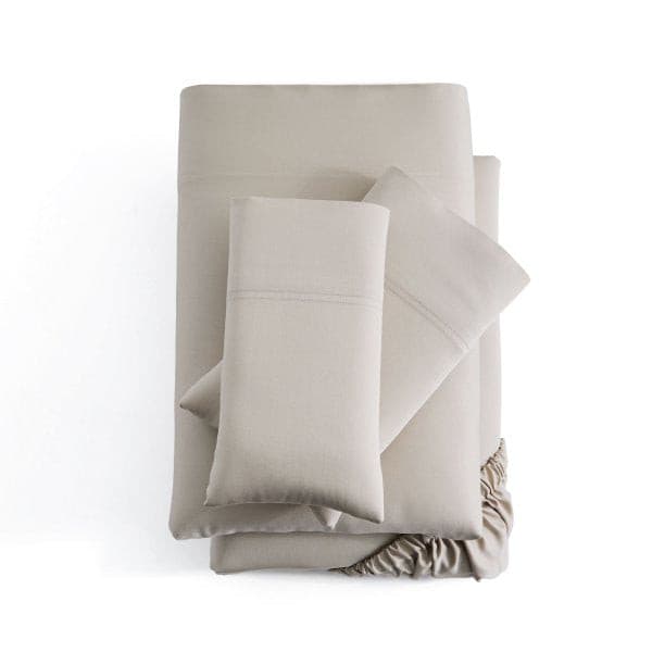 Malouf Smooth Driftwood Bamboo Rayon Sheet Set in soft beige color, featuring breathable and silky sheets with pillowcases.