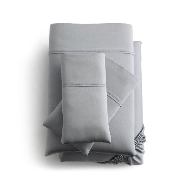 Malouf Dusk Botanical Tencel™ Lyocell sheet set in soft gray, featuring deep pockets and smooth sateen weave for comfort.