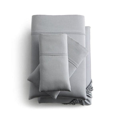 Malouf Dusk Botanical Tencel™ Lyocell sheet set in soft gray, featuring deep pockets and smooth sateen weave for comfort.
