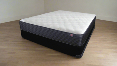 Eastman House Spruce Firm 9" mattress, designed for comfort and support, featuring breathable fabric for better sleep quality.