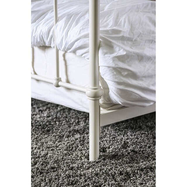 Iria White Metal Bed featuring sturdy metal construction and a chic white finish with a cozy mattress.