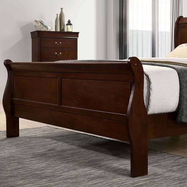 Louis Philippe Cherry Slate Bed with sleigh design and matching nightstand in a stylish bedroom setting.