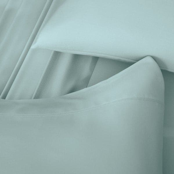 Malouf Smooth Rain Bamboo Rayon Pillowcase Set close-up, showcasing silky soft, breathable fabric in a soothing mint color.