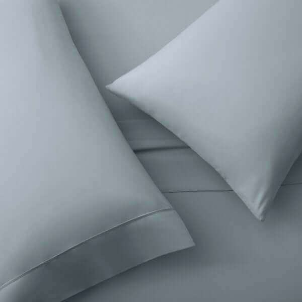 Malouf Pacific Soft Knit Microfiber Sheet Set in soft blue, featuring luxurious double-brushed pillows and silky smooth fabric.