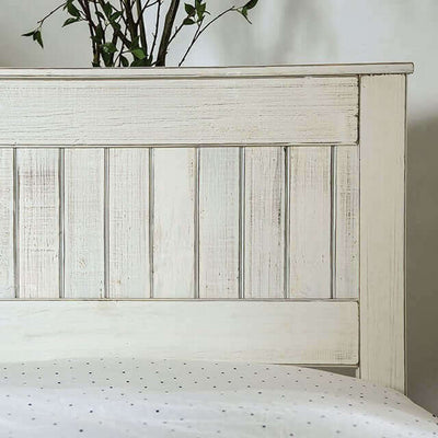 Rockwall Brushed White Panel Bed headboard featuring plank style construction and weathered gray finish.