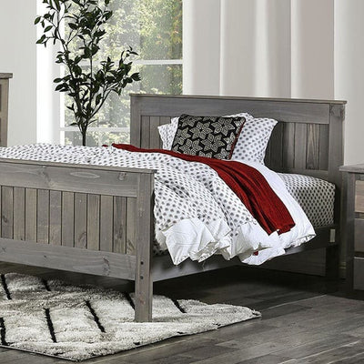Rockwall brushed gray panel bed with cozy bedding and decorative pillows in a bright, airy bedroom setting.