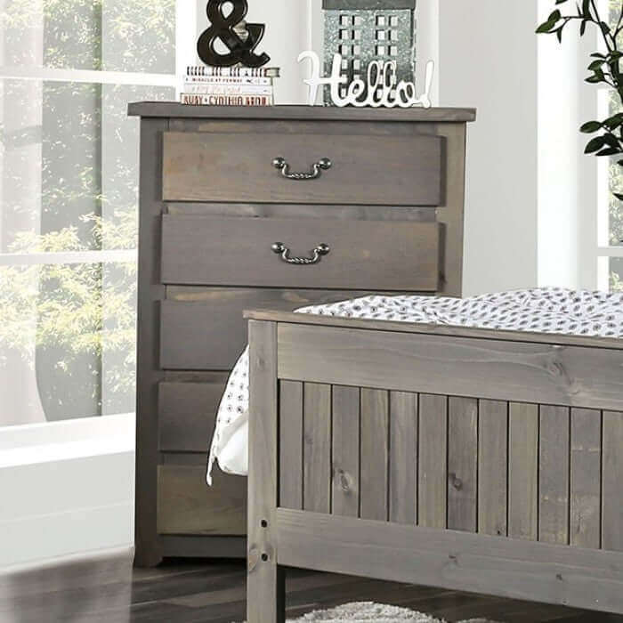 Rockwall Gray Chest by FOA in rustic weathered gray pine, showcasing 4 drawers in a bright bedroom setting.