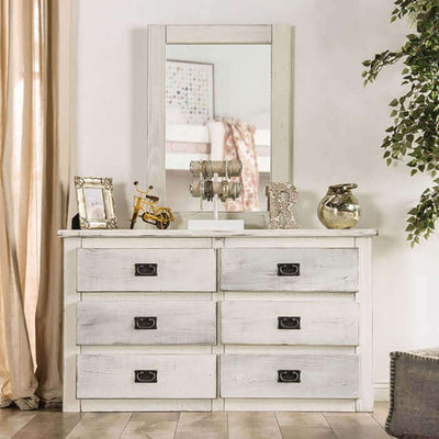 Rockwall white dresser with six drawers, featuring a weathered barn finish and a coordinating mirror in a stylish bedroom setting.