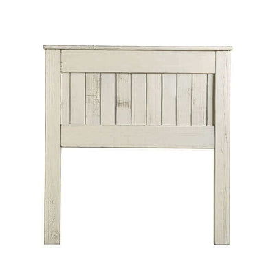 Distressed white wooden headboard featuring rustic plank design for a charming bedroom decor.