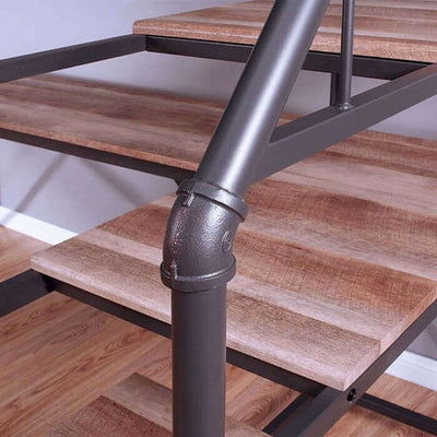 Close-up of metal piping and wood steps on the Rowley Bed/Workstation Metal Bunk Bed staircase, showcasing industrial design.