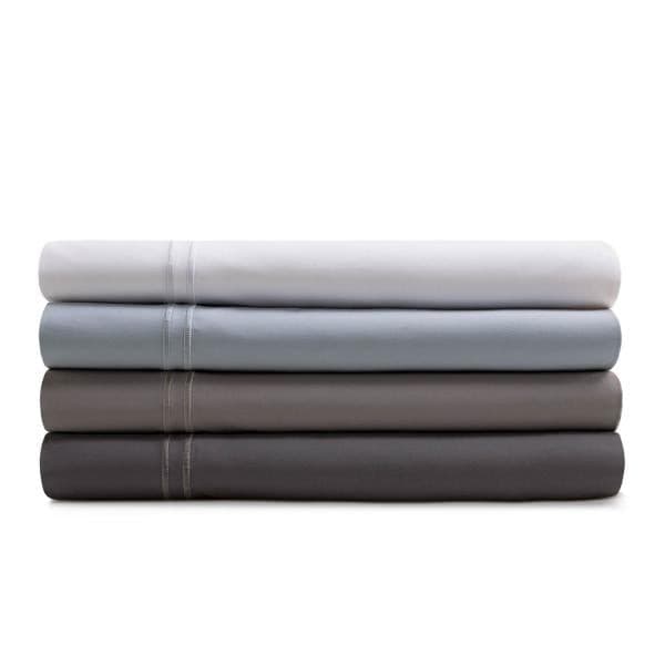 Malouf Premium Smoke Natural Supima Cotton Sheet Set in four colors: white, light blue, gray, and dark gray stacked neatly.