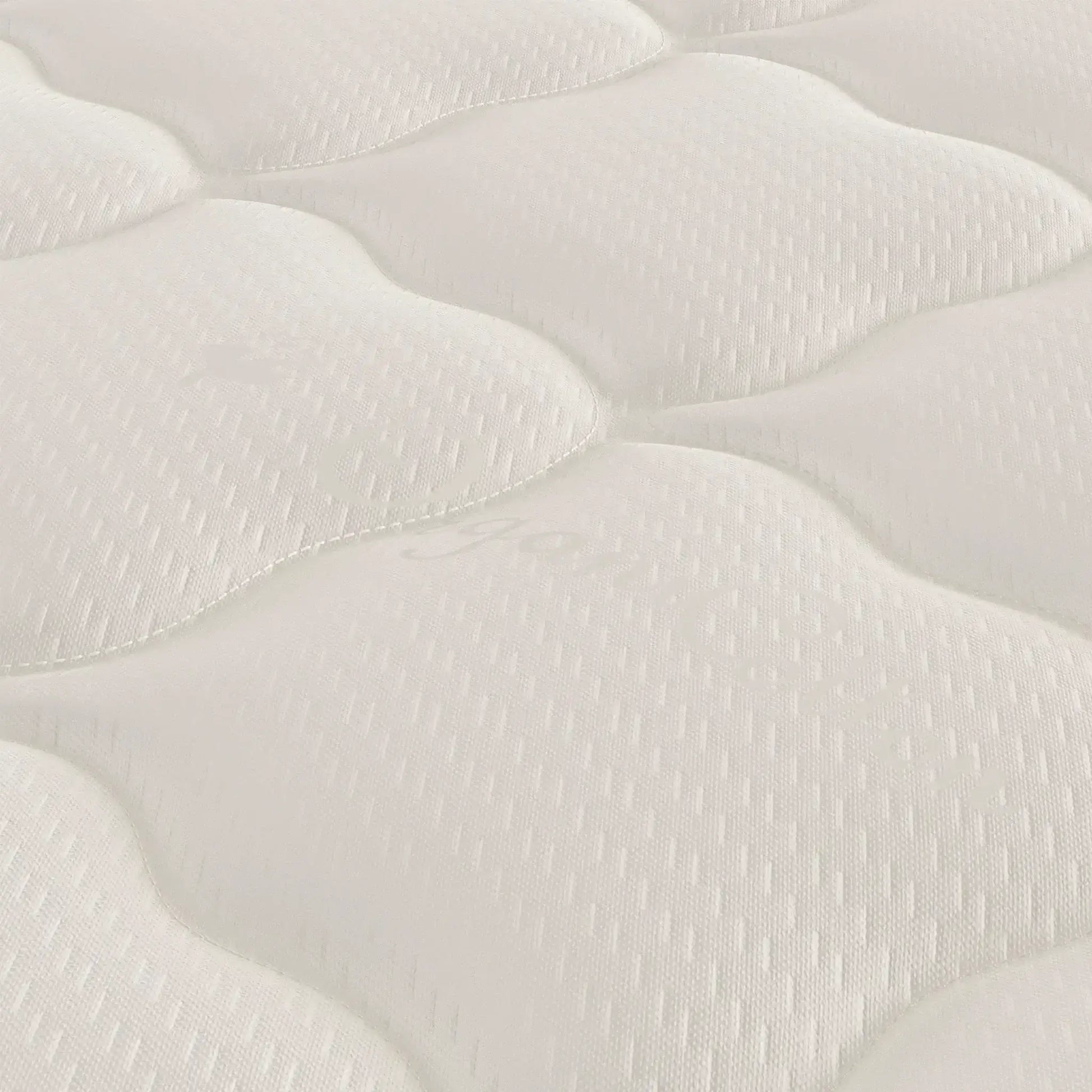 Close-up of the Harvest Green Essential GOTS Certified 10" Mattress surface, showcasing its organic cotton and wool texture.