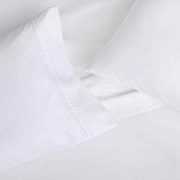 Malouf Premium Supima® cotton pillowcase set in luxurious white, showcasing soft sateen weave and deep fit.