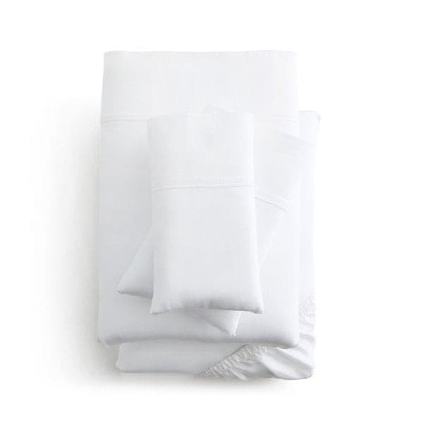 Set of Malouf white Botanical Tencel™ Lyocell pillowcases and sheets, eco-friendly and ultra-soft bedding collection.