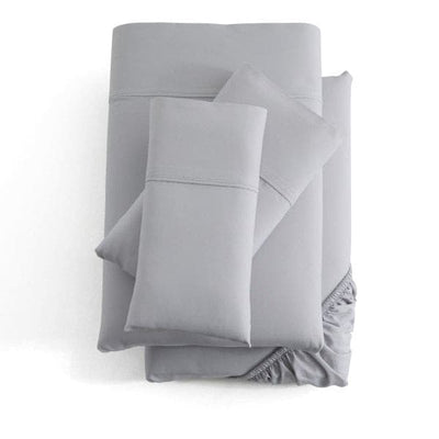 Malouf Ash Soft Knit Microfiber Sheet Set in light gray, featuring extra deep fit and soft brushed texture for cozy comfort.