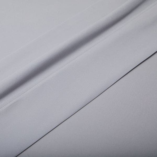 Soft gray microfiber fabric showcasing a cozy and velvety texture of Malouf Ash Soft Knit Microfiber Sheet Set.
