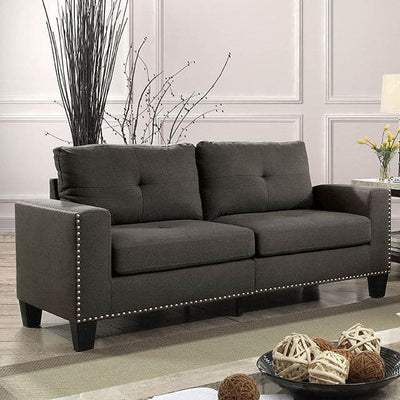 Attwell Dark Gray Transitional Sofa with squared silhouette, tufted seating, and nailhead trim in modern living space.
