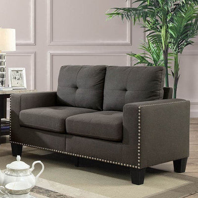 Attwell Dark Gray Transitional Loveseat with tufted seating and nailhead trim in stylish living room setting.