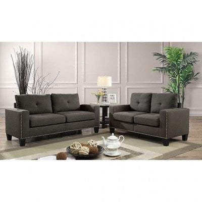 Attwell dark gray transitional sofa with tufted seating and nailhead trim in a stylish living room setting.